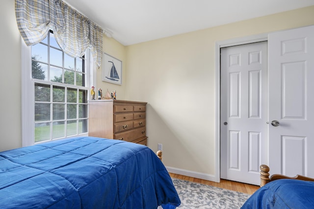 290 Riverview Ln, Centerville, MA 02632 - bedroom featuring multiple windows, wood finished floors, and baseboards