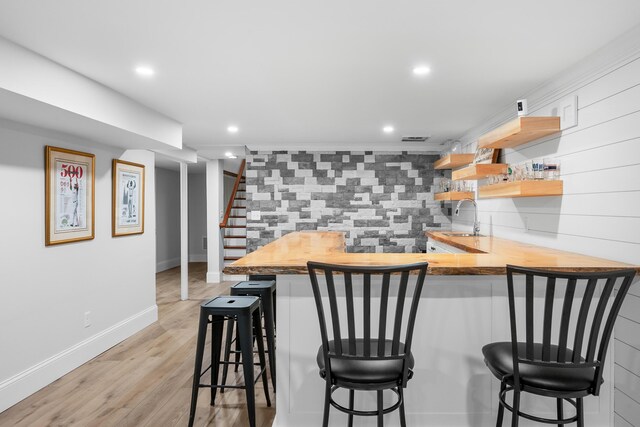 290 Riverview Ln, Centerville, MA 02632 - indoor bar with backsplash, light wood finished floors, stairway, and recessed lighting