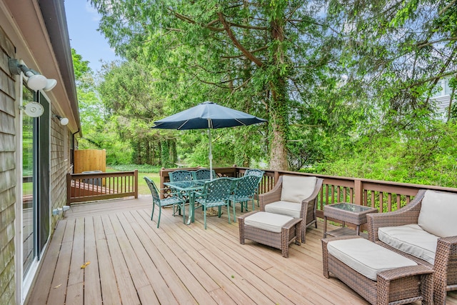 290 Riverview Ln, Centerville, MA 02632 - wooden deck with outdoor dining space, view of scattered trees, and an outdoor living space
