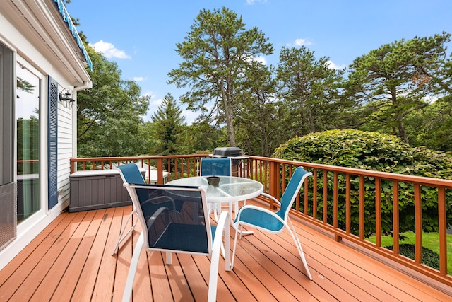 62-64 Old Fish House, South Dennis, MA 02660 - wooden deck featuring outdoor dining area and view of scattered trees