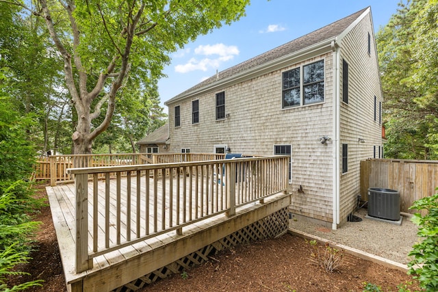 62-64 Old Fish House, South Dennis, MA 02660 - rear view of house with central AC, fence, and a deck