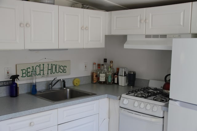 62-64 Old Fish House, South Dennis, MA 02660 - kitchen with white appliances, extractor fan, white cabinets, a sink, and light countertops