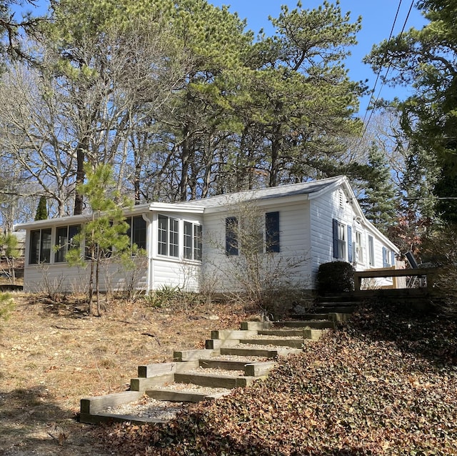 62-64 Old Fish House, South Dennis, MA 02660 - view of front of home with a sunroom