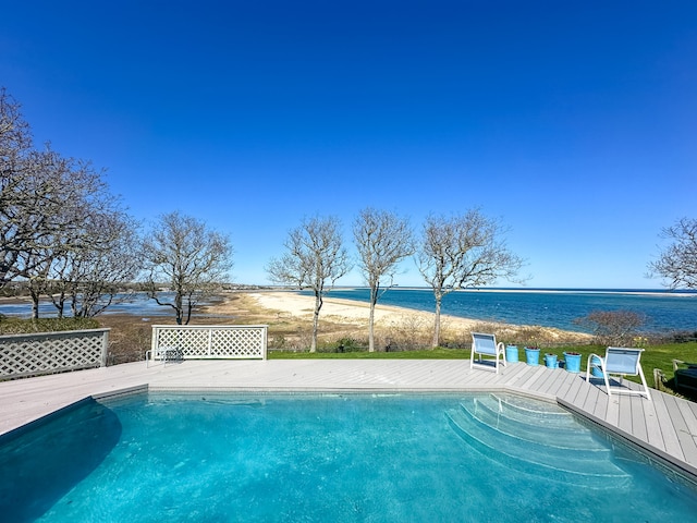 swimming pool with a deck with water view