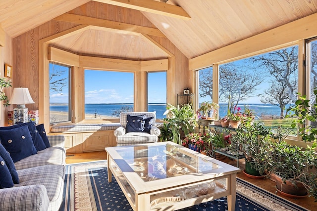 sunroom with lofted ceiling, a water view, wooden walls, wooden ceiling, and wood finished floors