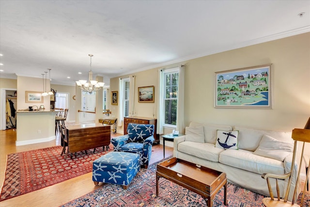 17 Chadwick Ct, Mashpee, MA 02649 - living room with a chandelier, light wood finished floors, ornamental molding, recessed lighting, and baseboards