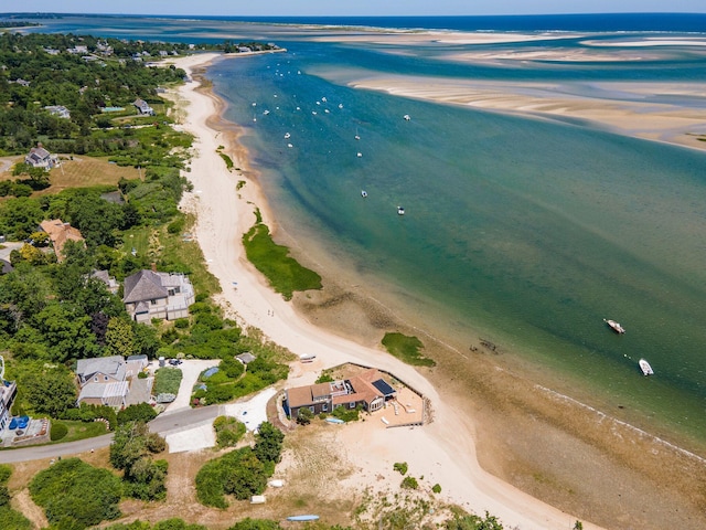 bird's eye view with a water view and a view of the beach