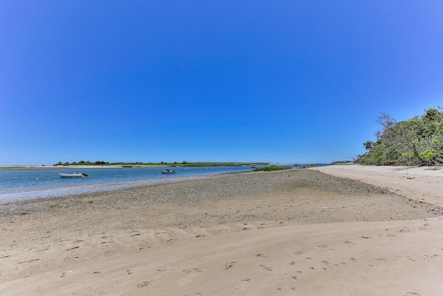 view of water feature with a beach view