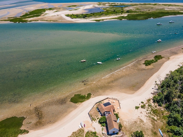 bird's eye view with a water view and a view of the beach