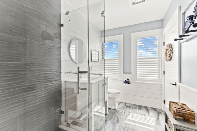 494 Shore Rd, North Truro, MA 02652 - full bathroom featuring a wainscoted wall, toilet, visible vents, and a shower stall