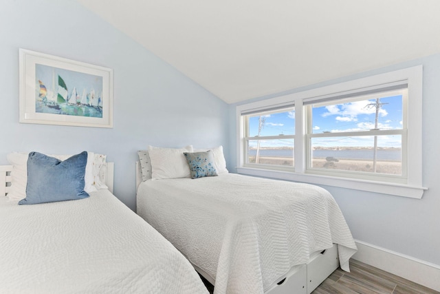 494 Shore Rd, North Truro, MA 02652 - bedroom featuring baseboards, wood finished floors, and lofted ceiling