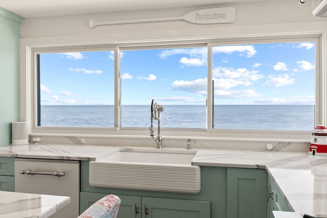 494 Shore Rd, North Truro, MA 02652 - interior space featuring green cabinetry, plenty of natural light, a sink, and a water view