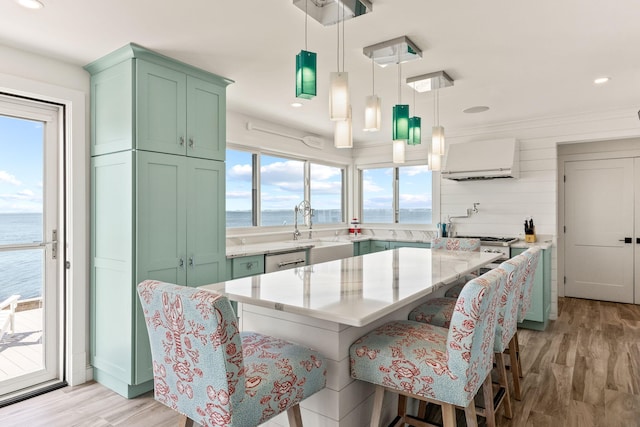 494 Shore Rd, North Truro, MA 02652 - dining area with light wood finished floors, a water view, and recessed lighting