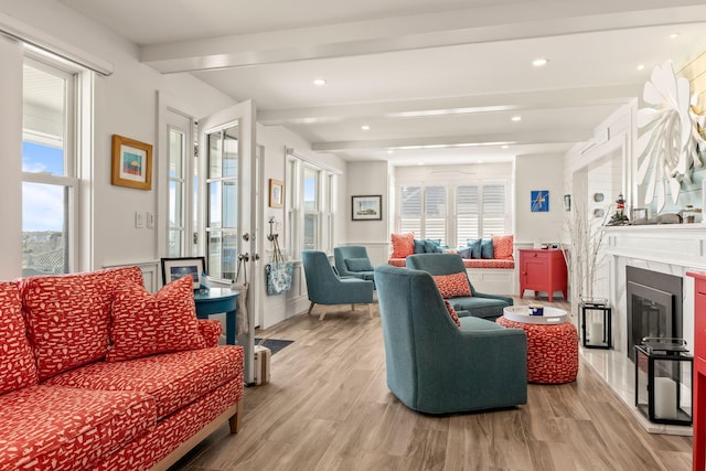494 Shore Rd, North Truro, MA 02652 - living area with beamed ceiling, recessed lighting, a glass covered fireplace, and light wood-type flooring