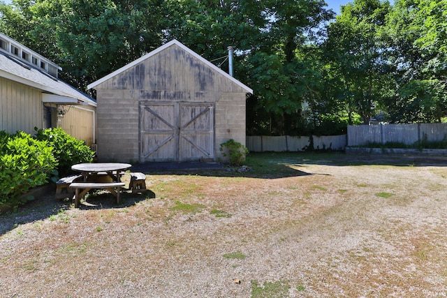 view of outdoor structure featuring a lawn