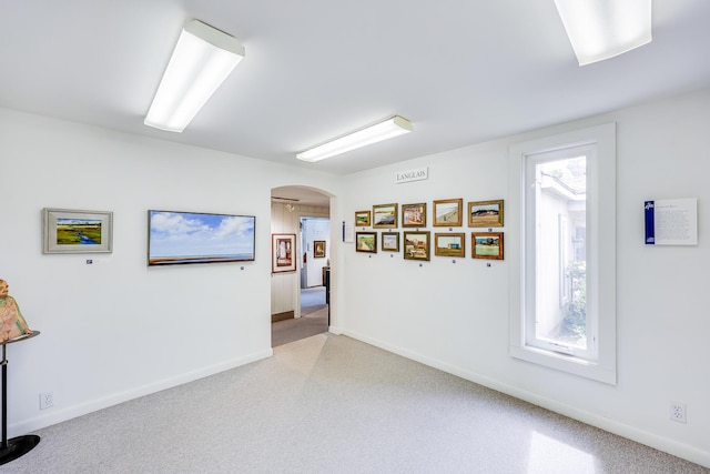 empty room with light colored carpet