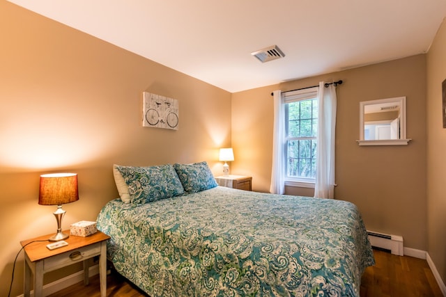 480 Forest Rd, South Yarmouth, MA 02664 - bedroom with baseboard heating and wood finished floors