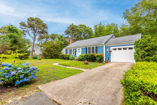 480 Forest Rd, South Yarmouth, MA 02664 - view of front of property featuring a garage, concrete driveway, a front lawn, and a chimney