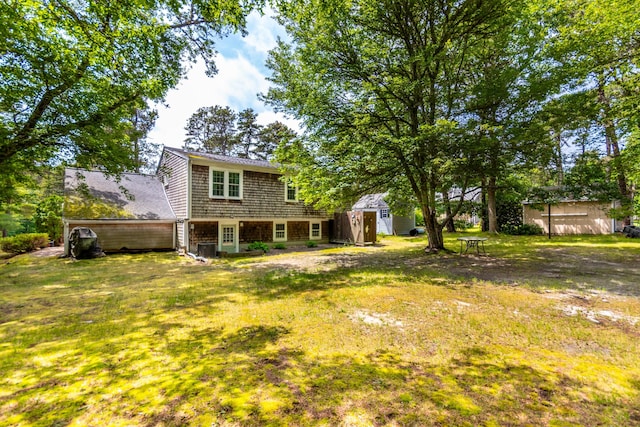 480 Forest Rd, South Yarmouth, MA 02664 - view of green lawn featuring a storage shed