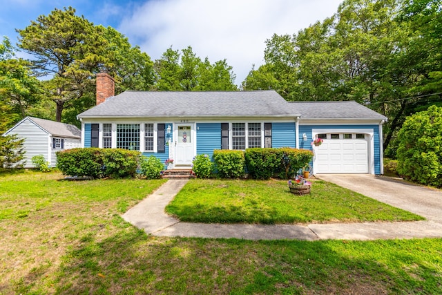 480 Forest Rd, South Yarmouth, MA 02664 - view of front of property featuring an attached garage, a chimney, a front yard, and concrete driveway