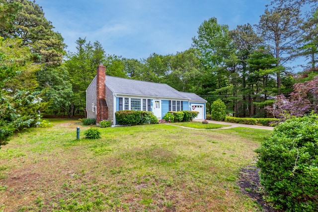 480 Forest Rd, South Yarmouth, MA 02664 - view of front of property featuring a chimney, a front yard, and a garage