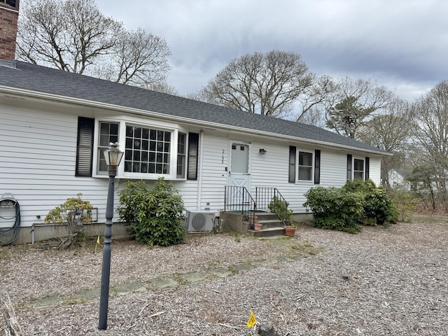 ranch-style house with ac unit