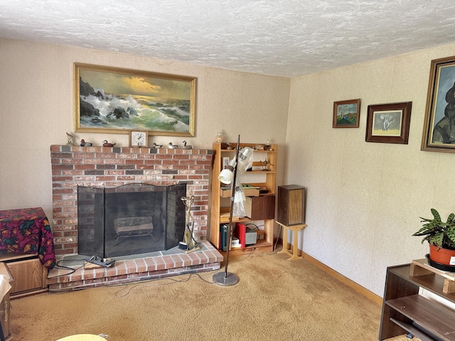 living area with carpet floors, a textured ceiling, a brick fireplace, and baseboards