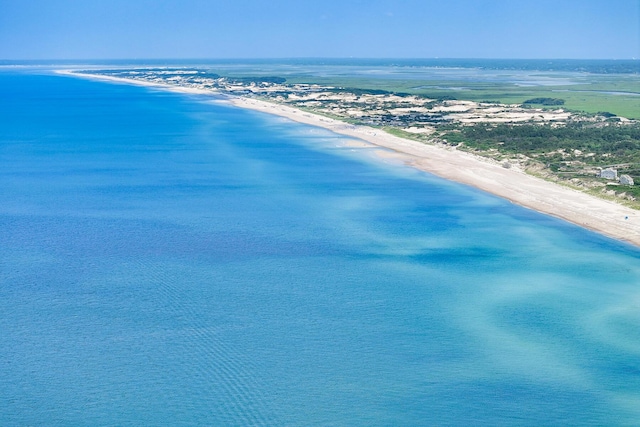 aerial view with a water view and a view of the beach