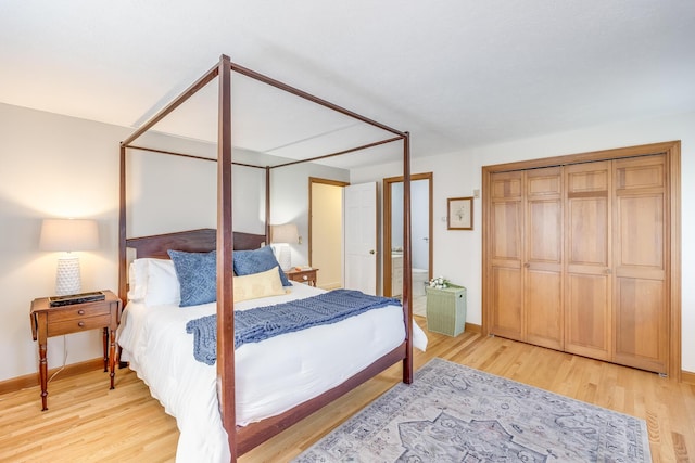 bedroom featuring baseboards and wood finished floors
