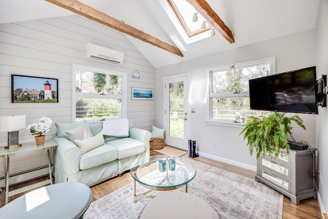 living area with vaulted ceiling with skylight, a wall mounted AC, wood finished floors, a baseboard radiator, and wooden walls