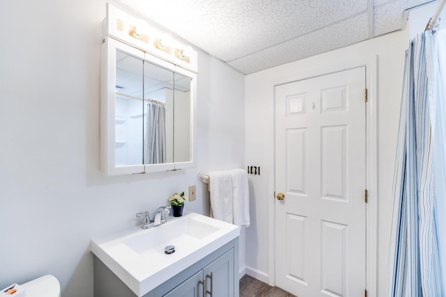 full bathroom with vanity, wood finished floors, toilet, and a shower with curtain
