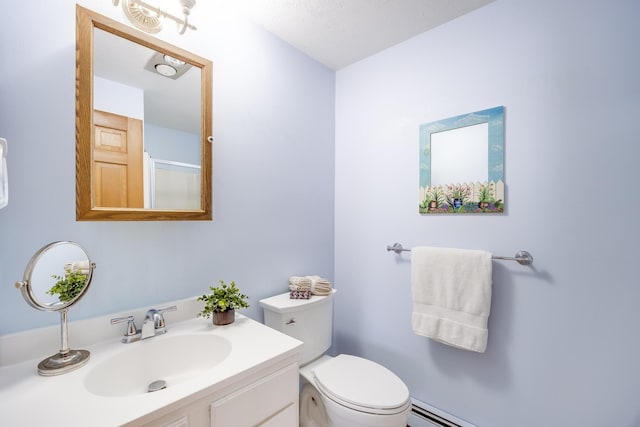 bathroom featuring toilet, a baseboard radiator, and vanity