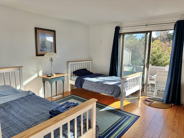 bedroom with hardwood / wood-style floors