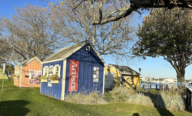 view of outdoor structure featuring a lawn