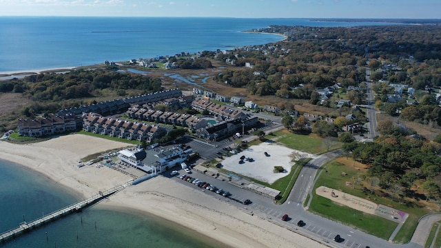 bird's eye view featuring a water view and a beach view