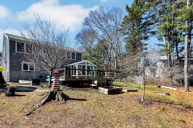 51 Buccaneer Way, Mashpee, MA 02649 - rear view of property featuring a wooden deck, stairs, a lawn, and a garden