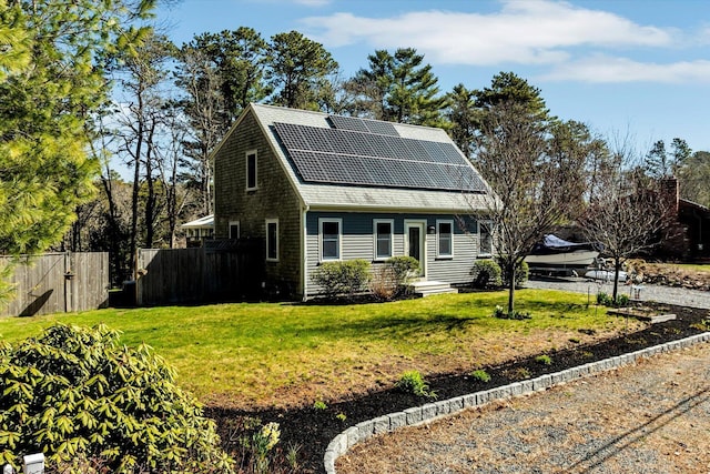 51 Buccaneer Way, Mashpee, MA 02649 - view of front of house featuring roof mounted solar panels and roof with shingles