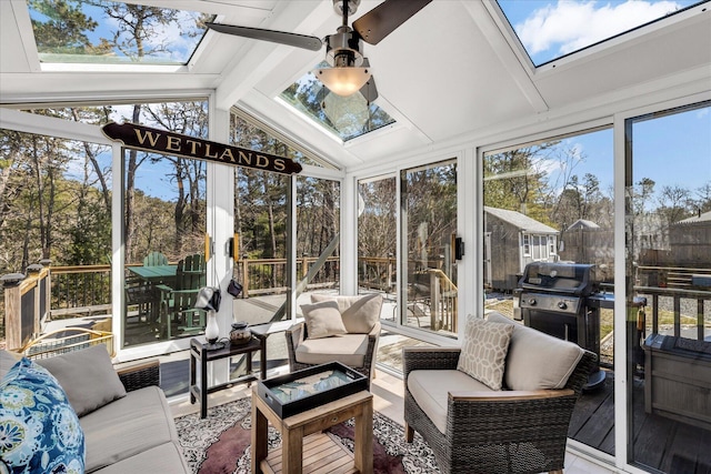 51 Buccaneer Way, Mashpee, MA 02649 - sunroom / solarium with a skylight, an outdoor living space, vaulted ceiling, a ceiling fan, and floor to ceiling windows