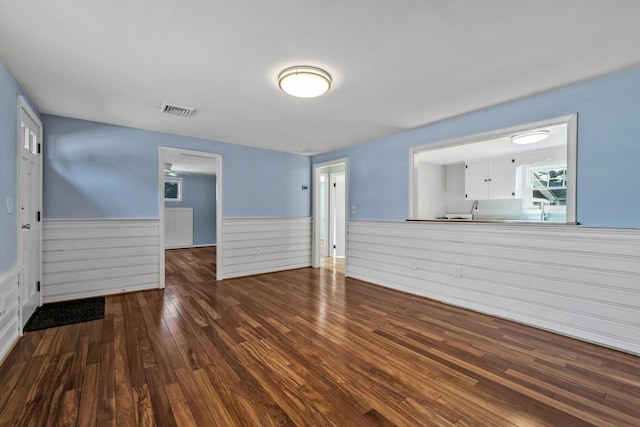 spare room featuring dark hardwood / wood-style flooring