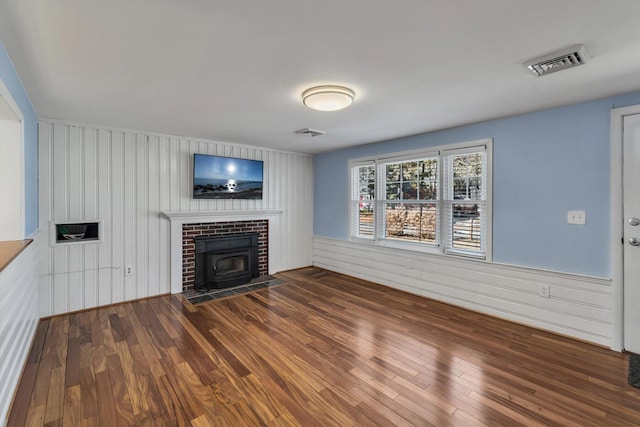 unfurnished living room with wood-type flooring