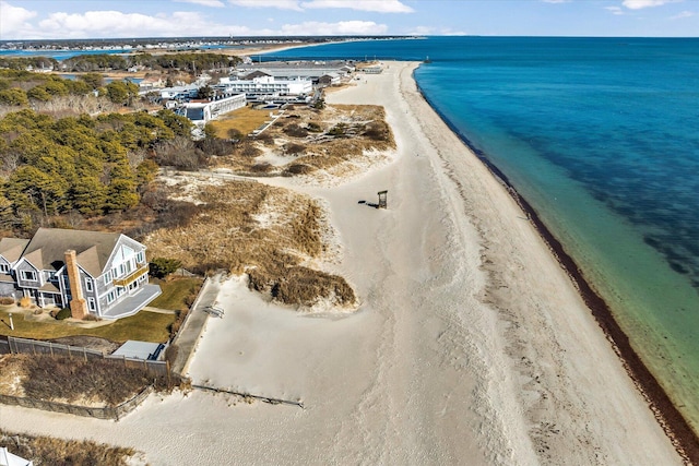 bird's eye view featuring a view of the beach and a water view