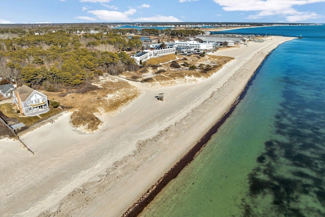 birds eye view of property featuring a water view and a view of the beach