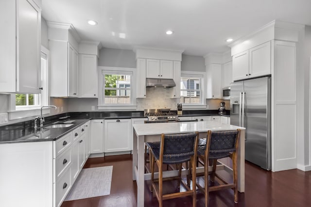 4 Race Rd Unit U2, Provincetown, MA 02657 - kitchen featuring stainless steel appliances, under cabinet range hood, healthy amount of natural light, dark wood finished floors, and recessed lighting