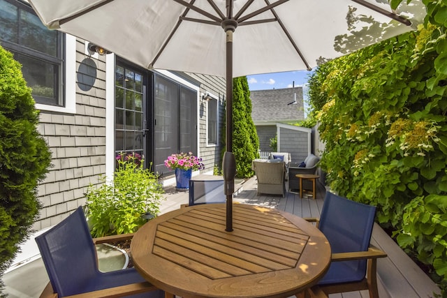 4 Race Rd Unit U2, Provincetown, MA 02657 - view of patio with outdoor dining space and a wooden deck