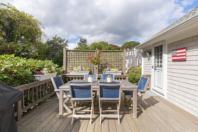 wooden deck featuring area for grilling