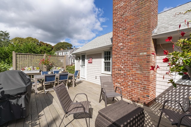 wooden deck with grilling area