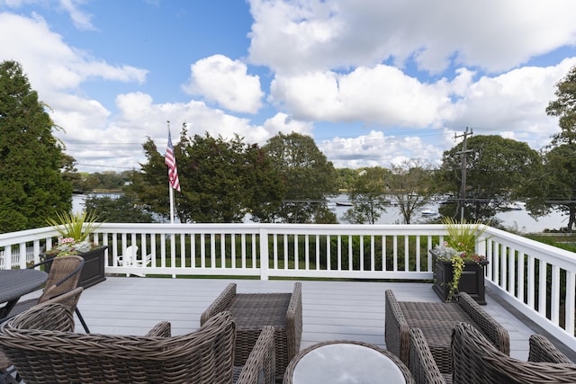 wooden deck featuring a water view