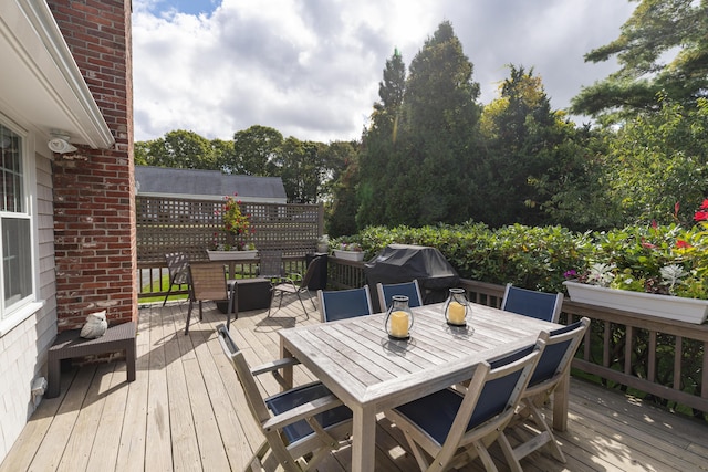 wooden terrace with area for grilling