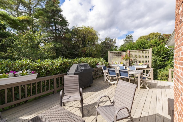 wooden deck featuring grilling area