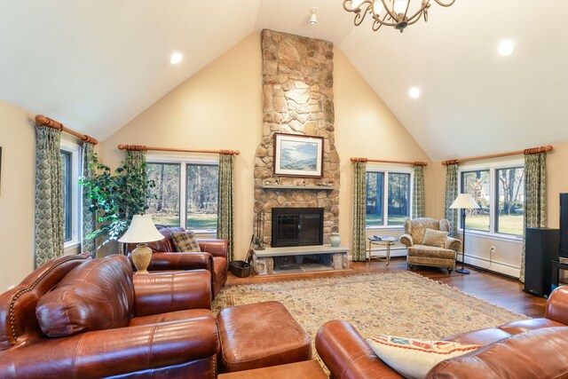 dining space featuring recessed lighting, baseboards, ornamental molding, baseboard heating, and light wood finished floors